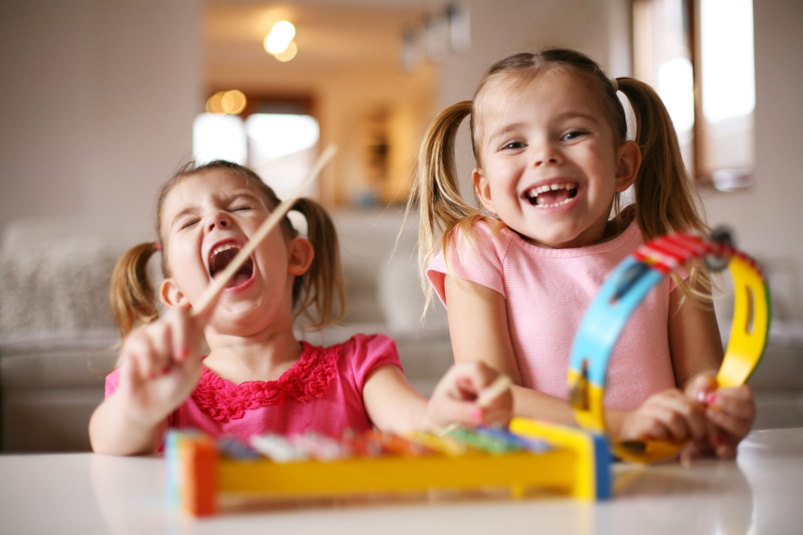 Two young girls with instruments
